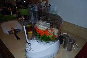 Large Onion, two carrots, three stalks of celery, 4 cloves of garlic into the food processor